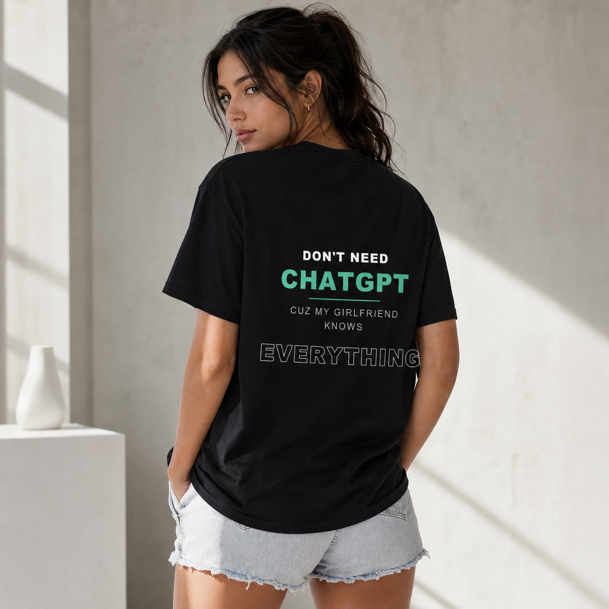 Woman wearing Don't Need ChatGPT unisex black T-shirt — back view